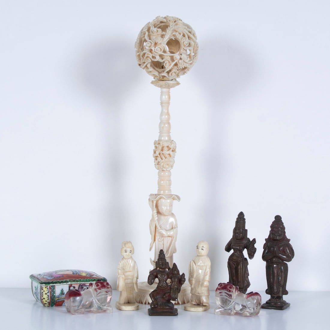 Asian Decorative Objects (nine): DRAGON CLOUD, two carvings, orb 2 1/2” diameter, man 7 1/2” tall, overall 11” tall with Quake Hold putty support, Two 2 1/2” carvings with detachable bases, 1 1/2 x 2 1/2 x 2&r