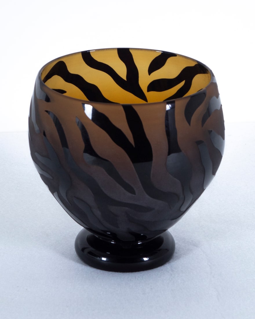 Correia Art Glass Studio: Brown and black bowl with etched tiger stripe pattern, signed and dated 1999 and numbered 50/500 Limited Edition underneath, 6 ¾” tall, 6 ½” diameter.