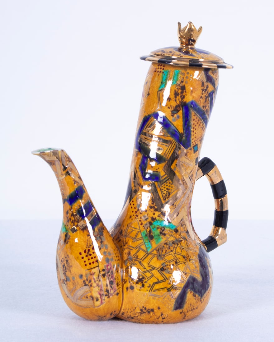 Randy Au (20 th Century) Hawaiian: Colorful pattern in squash veggie shape, painted and glazed porcelain teapot, signed underneath, 9” tall, 7 ½” wide. Acquired from/ Provenance: Pacific December 1991.