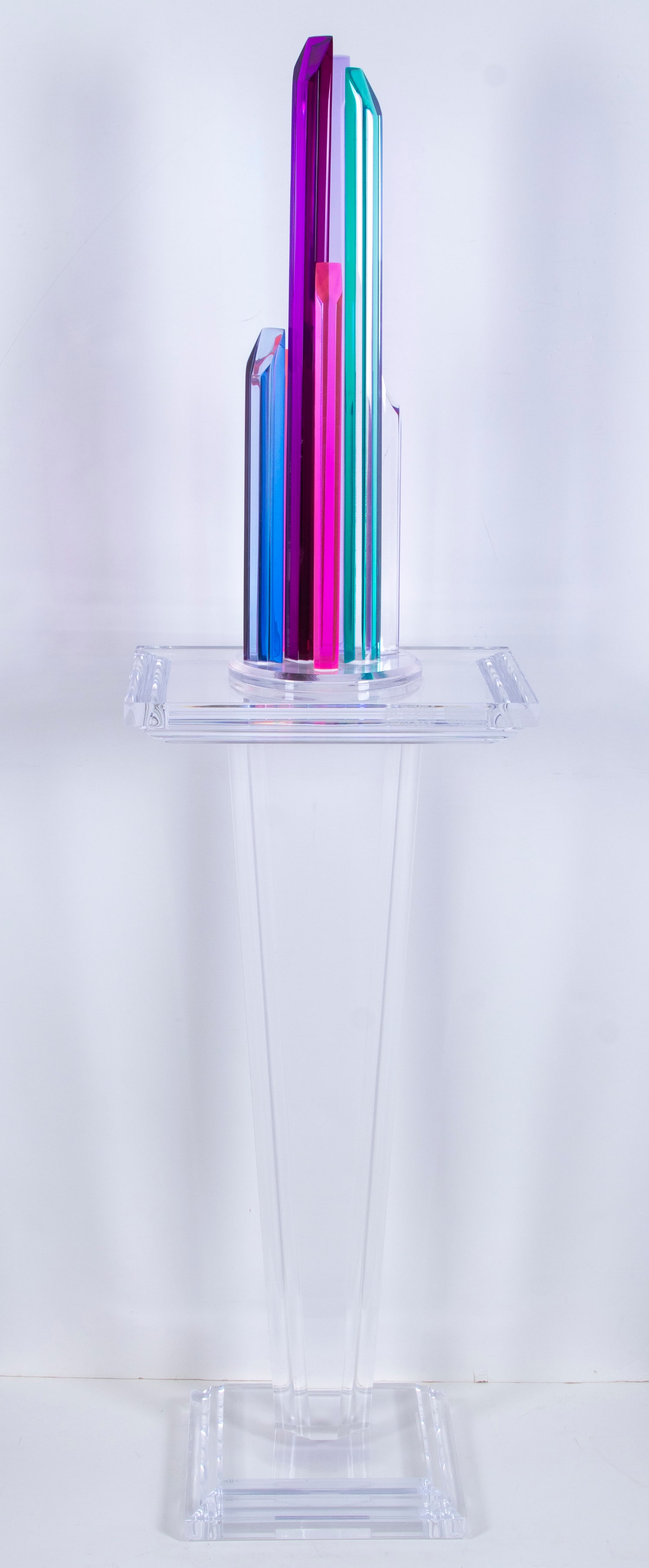 Shlomi Haziza (b. 1969) Israeli American: STALAGMITES, color and clear acrylic sculpture, a signature not found, 25” tall, with artist’s clear acrylic pedestal with artist’s label at base, 36” tall, overall 61” tall. (2)