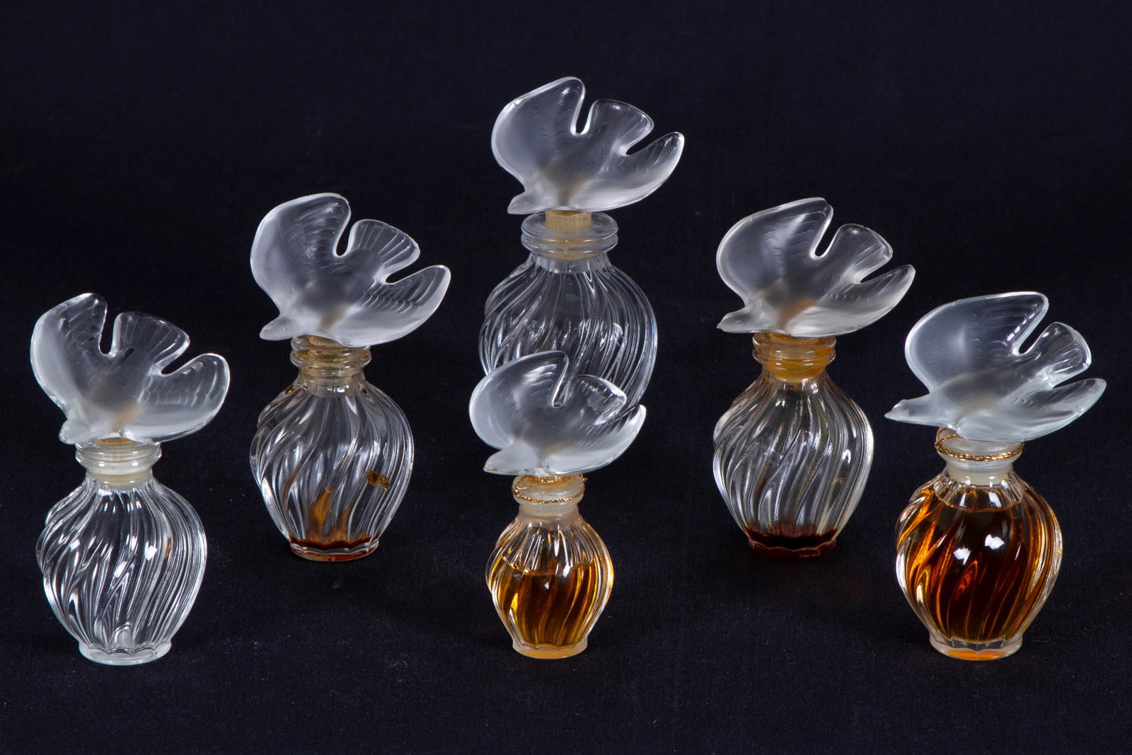 Lalique for Nina Ricci Perfumes (six): Doves, six clear and frosted petit perfume bottles, all hallmarked, sizes from 4” tall & 3 ½” tall, one with original box. (6)