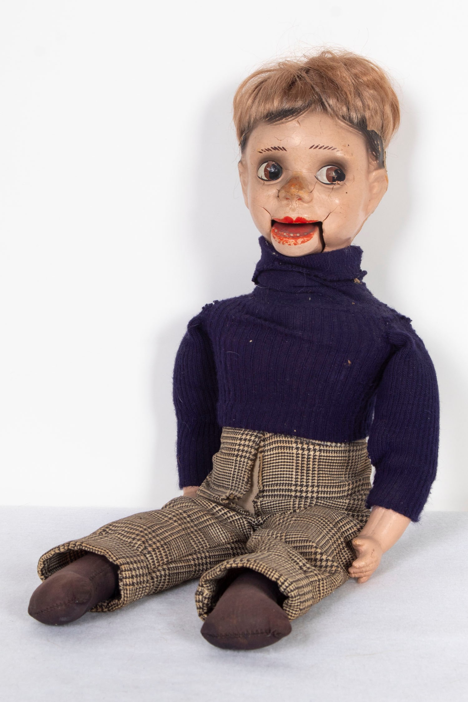 Vintage Ventriloquist Doll: Painted wood or plastic with fabric clothes and hair, 20 ½” tall. From the collection of Faith Flam, lifelong friend of Betye Saar.
