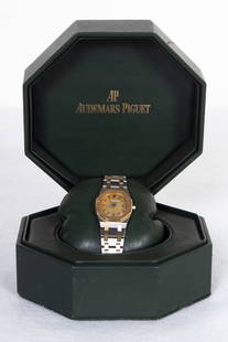 Audemars Piguet Royal Oak watch: Ladies’ Royal Oak #3147 quartz watch with stainless and gold wrist band, gold face case and gold mess patterned face, with box 3 x 5 x 5”.