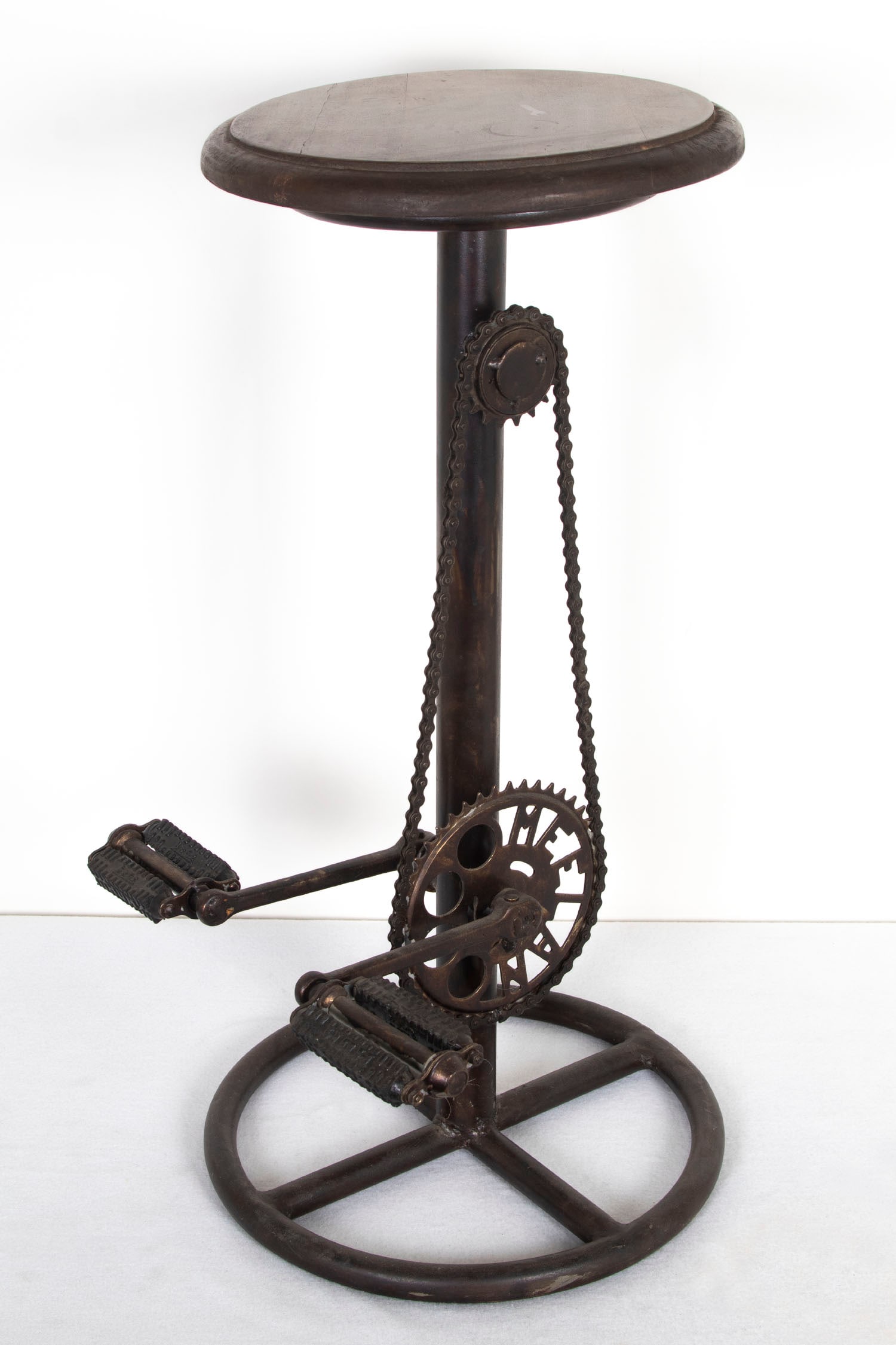 Bicycle bar stool: Wood seat with industrial metal body with Meelan sprocket and Hum pedals, overall 29 x 16 x 18”. From the Collection of Urban S. Hirsch III.