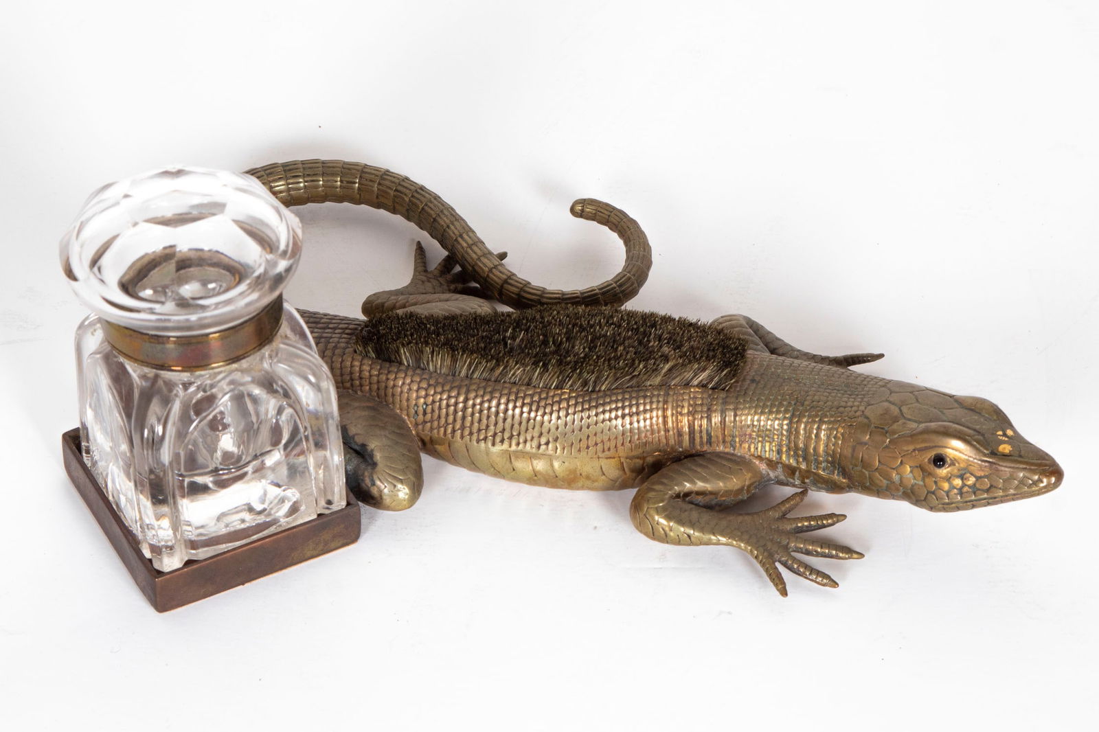 Iguana Inkwell: Brass inkwell with brush back and leather padded tray for 3 ½” tall glass well, overall 10” long. From the Collection of Urban S. Hirsch III.