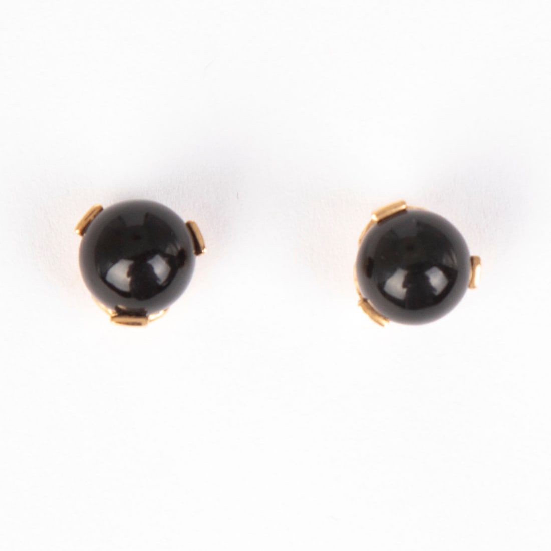 Jewelry: 18k Yellow Gold and Onyx Earrings: A pair of 18k yellow gold earrings with round onyx beads, each 8 mm. Note: with one 14k white gold backing only, not original to the set. Display/box not included.