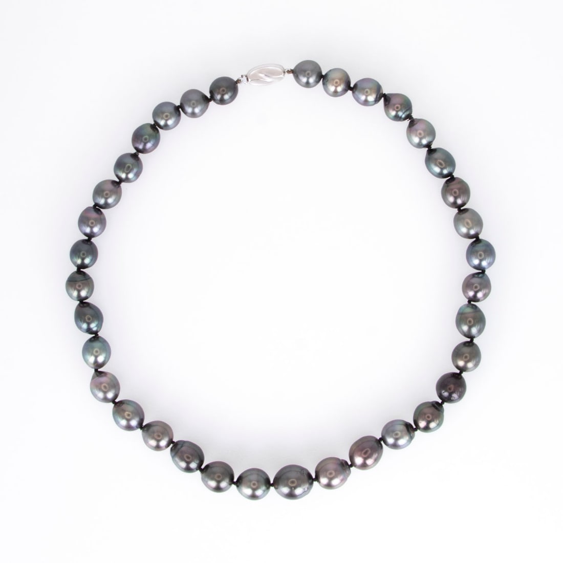 Jewelry: Black Tahitian Pearl Strand Necklace: Pearl necklace with round and pear-shaped pearls, pearls approximately 12 mm around center and tapering down to 10 mm, with stamped white-gold clasp, 16” length, weighs 64.4 grams. Display/box n