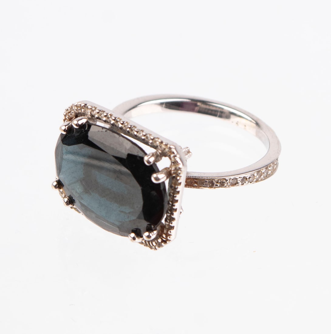 Jewelry: 14k Gold Ring with Spinel and Diamonds: 14k white gold ring with 7.85 carat prong-set oval brilliant cut spinel surrounded by bead-set round diamonds, Spinel 3 rated, diamonds SI-1, colors J-K, size 8.75, weighs 6.8 grams. Display/box not i