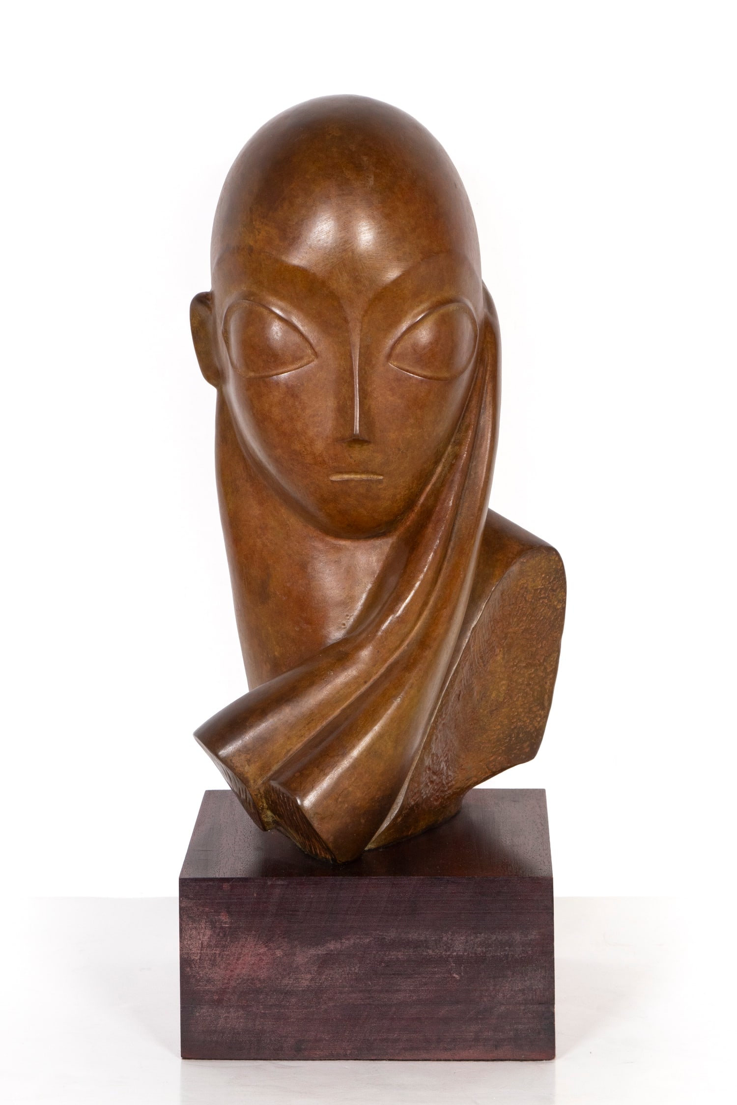 Attributed to or after Constantin Brancusi (1876-1957) Romanian: MADEMOISELLE POGANY, cast bronze sculpture with patina, signed, 16 ½” tall, mounted to wood base overall 20 ½ x 8 x 9”, weight 30 lbs.