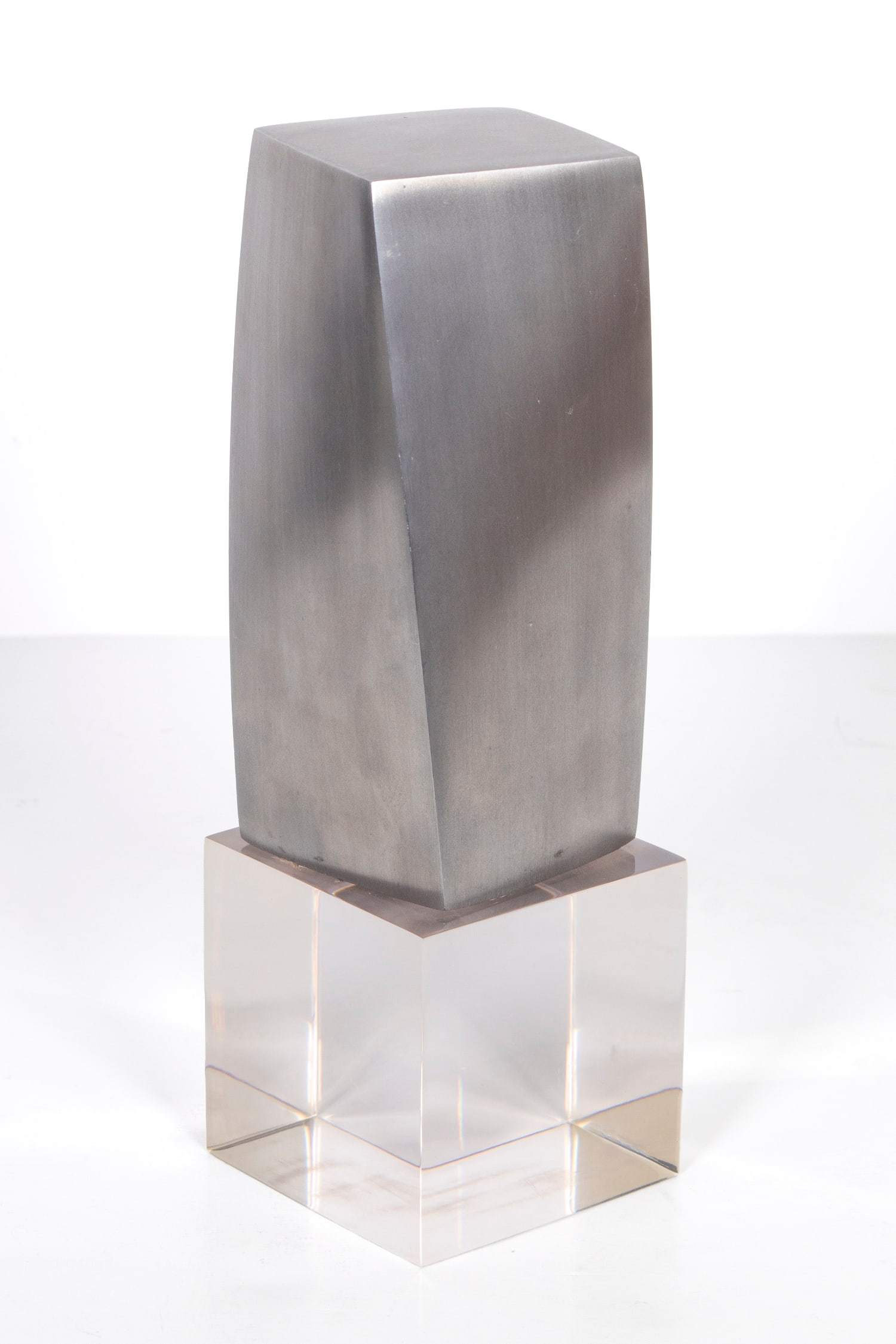 Frank Gehry (1929-2025) American: AWARD, 1999, cast brushed aluminum sculpture, signed and dated underneath and stamped “For Knoll Sales Meeting San Juan Puerto Rico” underneath, 7 x 3 /4 x 3 ¼”, mounted to acryli