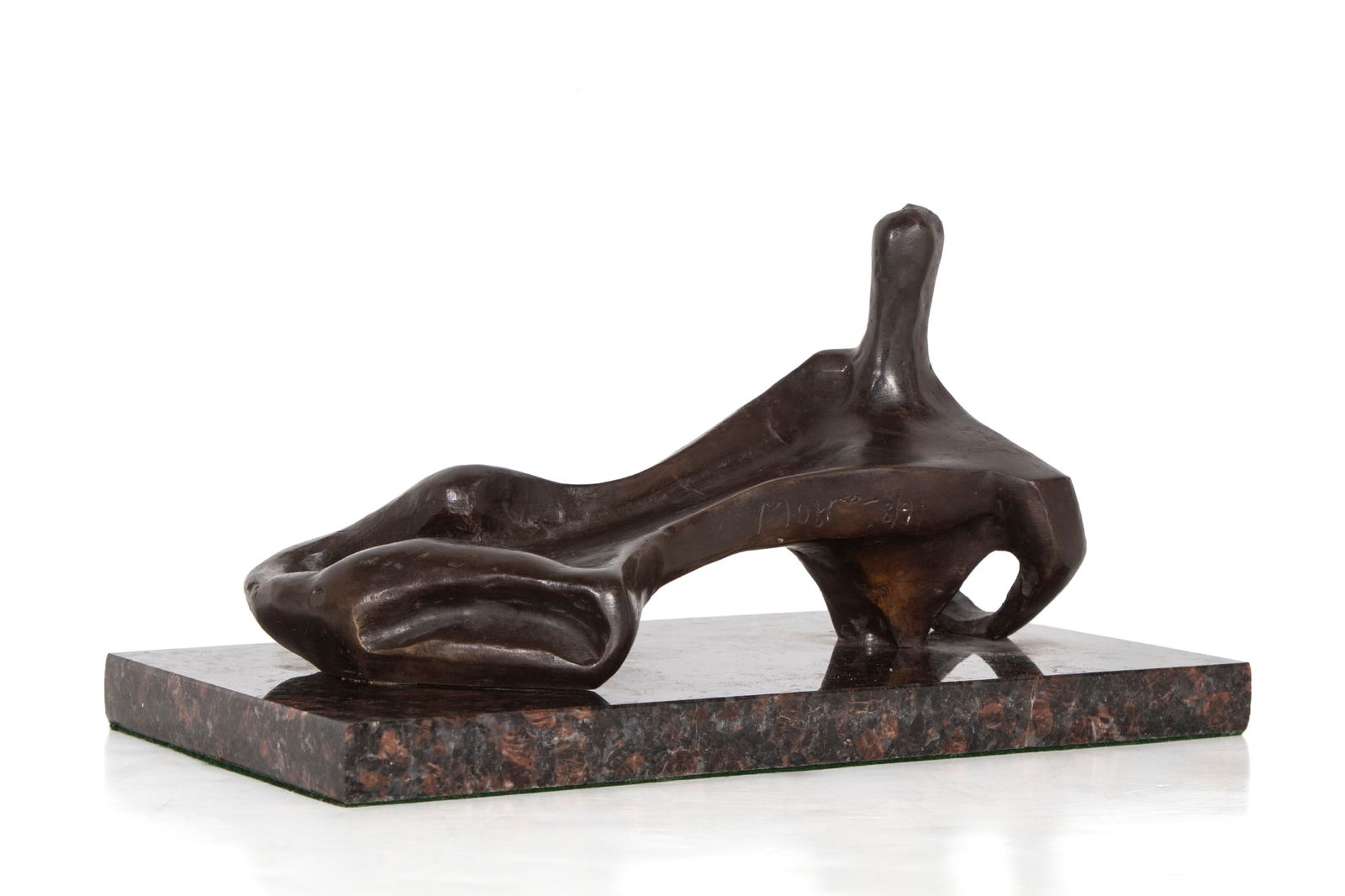 Attributed to or after Henry Moore (1898-1986) British: RECLINING FIGURE, cast bronze sculpture with dark brown patina, signed and numbered 8/9 on backside, 5 ½ x 9 ½ x 5 ½”, mounted to marble base overall 6 ½ x 12 x