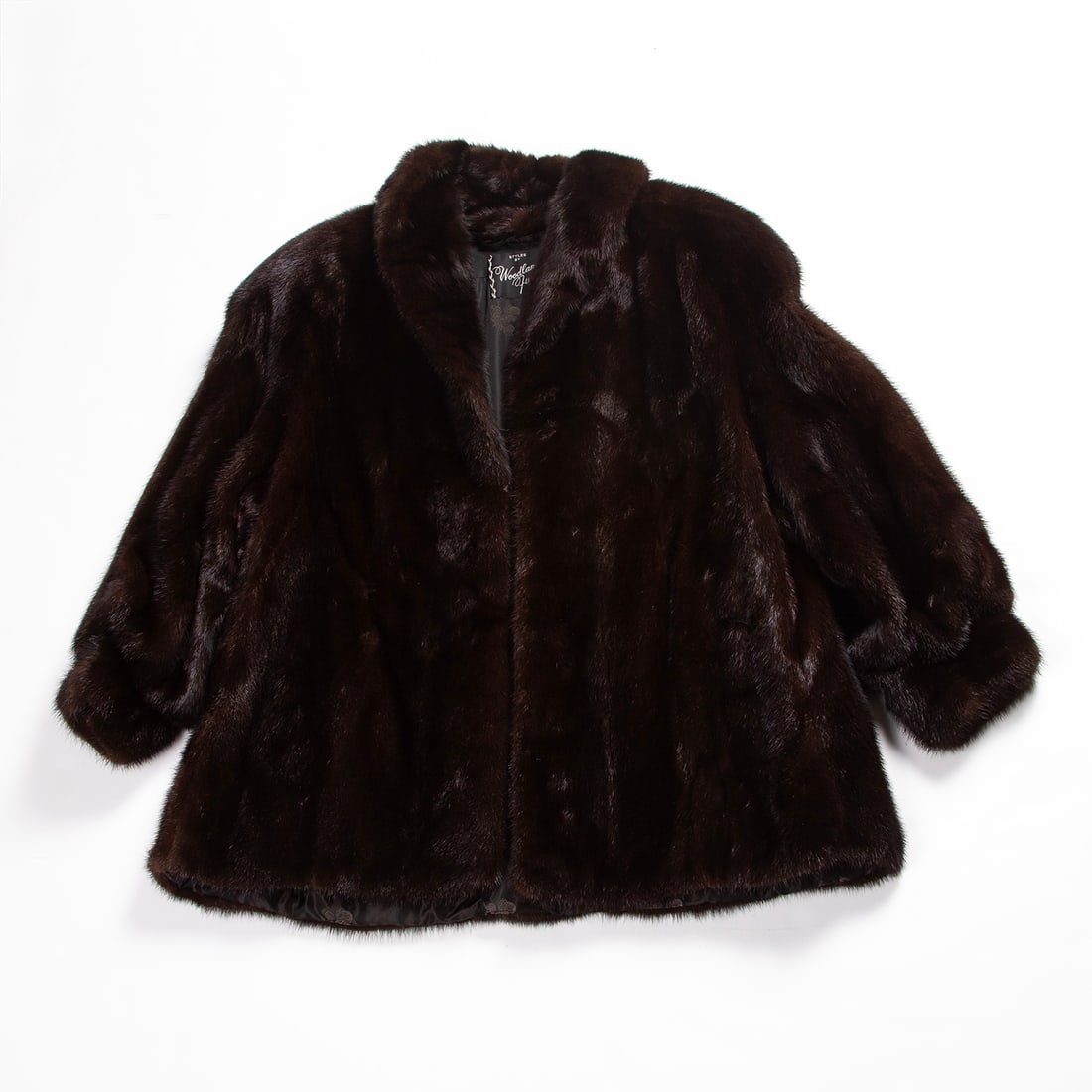 Mink Coat: Mink car coat with embroidered and monogramed satin lining, two hidden velvet lined side pockets, Woodland Hills Furriers Inc. California label in lining. Estimated size Women’s size 8-10, with trav