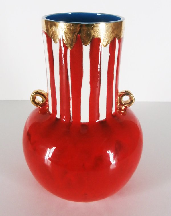 Ceramic: Anna Silver: Red vessel flanked with rope loops, painted and glazed in colors and gilded, 16 ½” tall, 11” diameter.