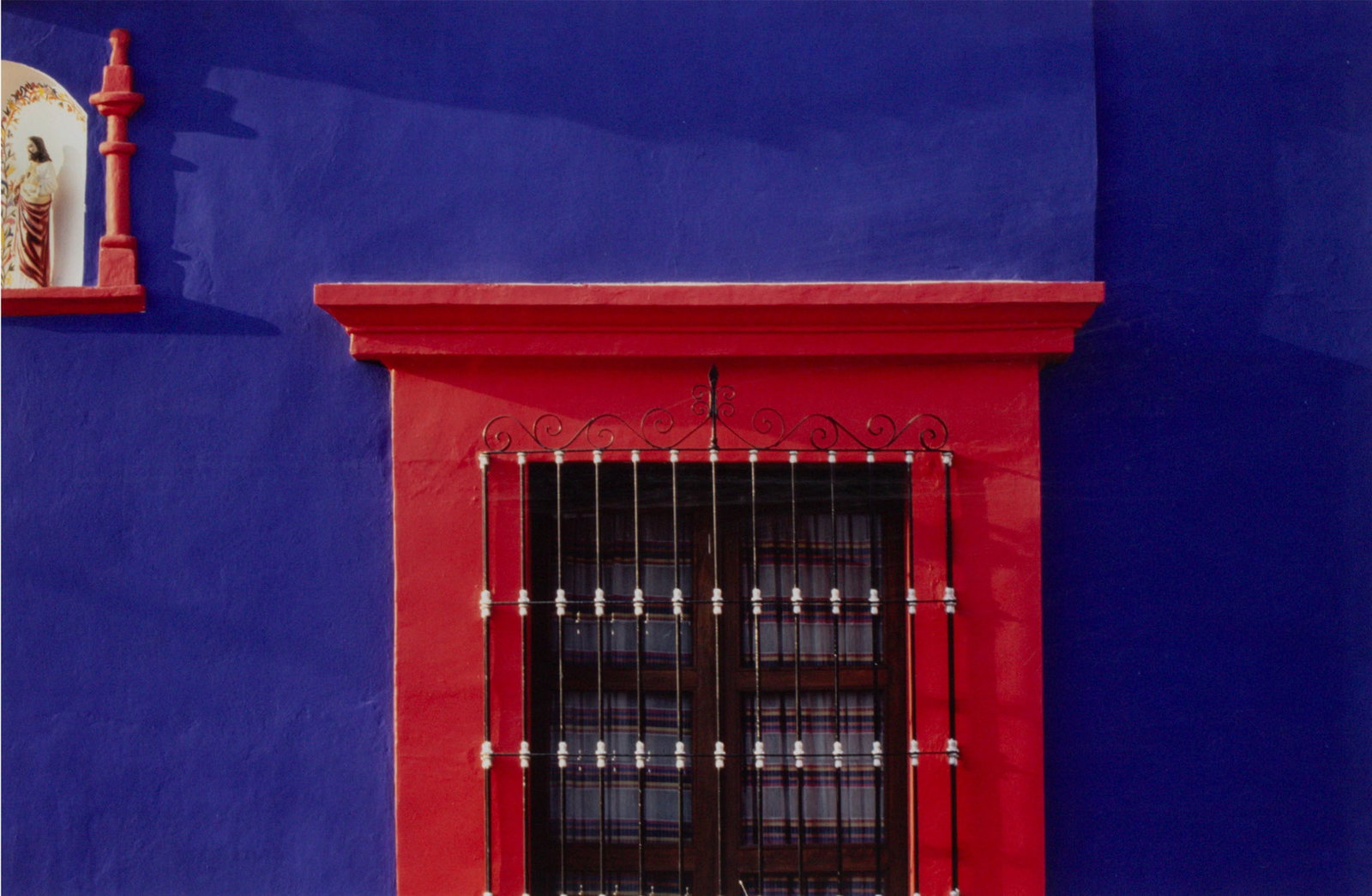 Gary Geiger (20th /21st Century) California: RED DOOR MANTLE, 1993, color photograph, signed and dated in pencil on mat, sight 19 ¼ x 29 ¼”, frame 30 ¼ x 40 ¼” with glass.