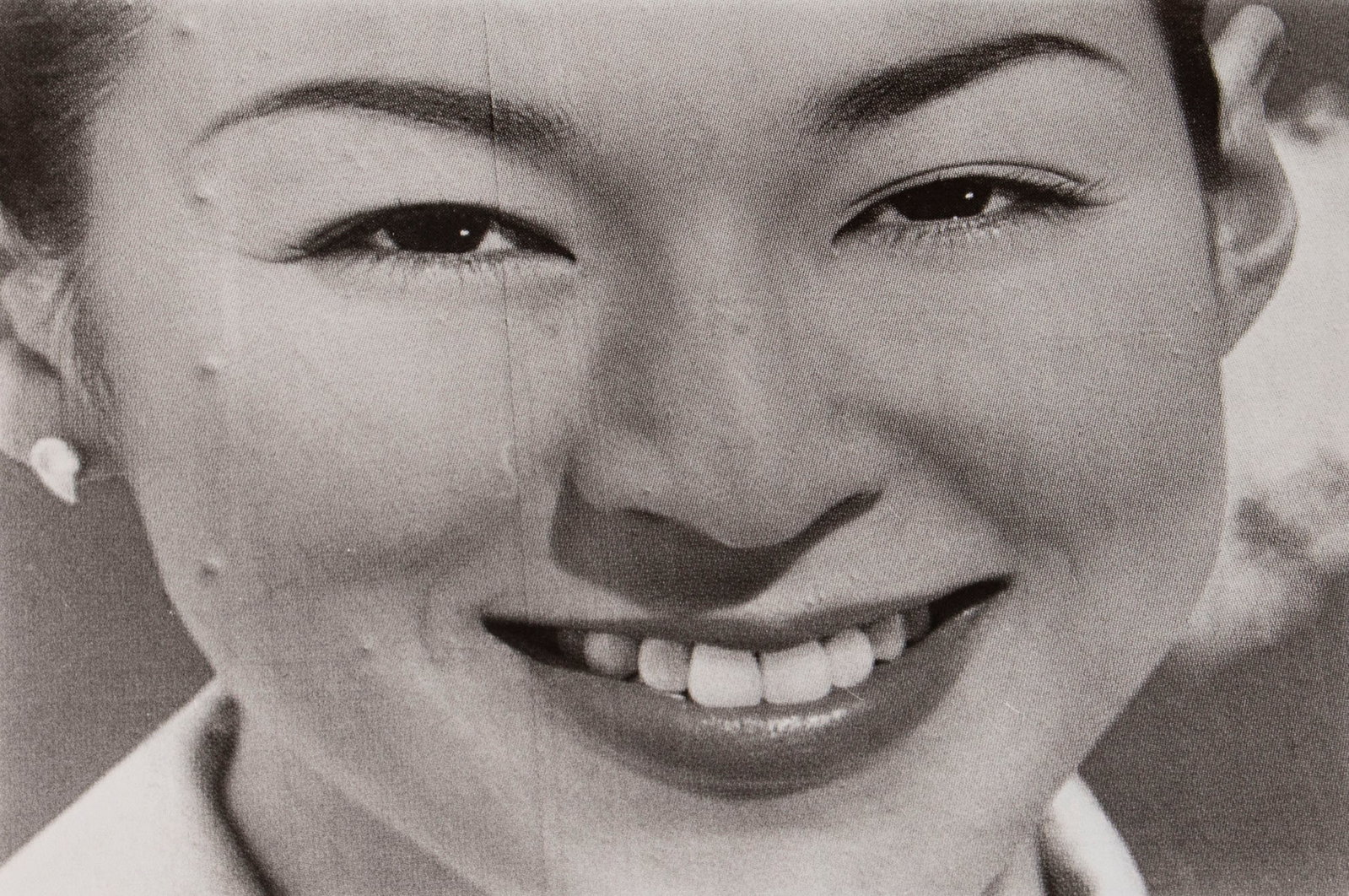 Reinhold Mittersakschmoller (20th Century) Austrian: SMILING WOMAN, photograph, artist’s stamp and signed in ink on verso, 9 ½ x 12”.