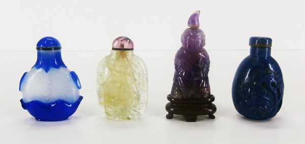 Chinese Snuff Bottles (four): Blue and white Peking glass snuff bottle, Chinese Beryl snuff bottle with dragon design, Carved Chinese amethyst snuff bottle, Carved Lapis Lazuli Chinese snuff bottle, 2 ½” each, three with spoons