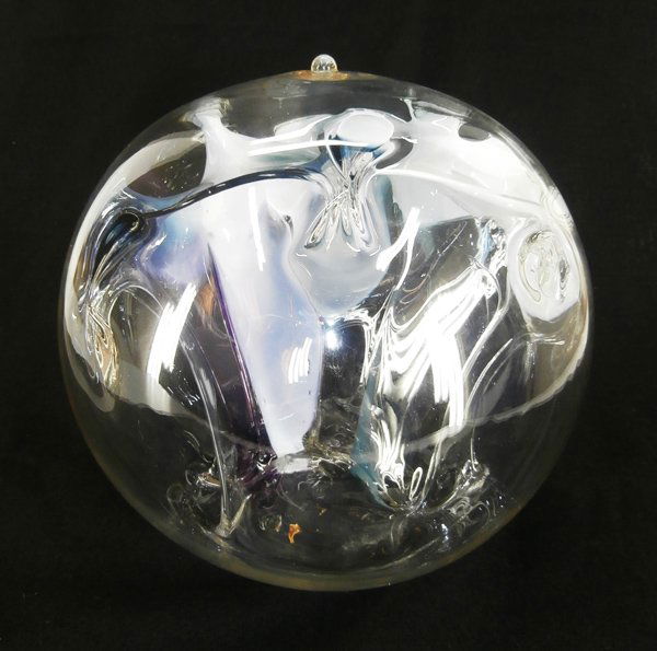 Glass: Peter Bramhall (b. 1942) American: UNTITLED, a clear glass body with color free-form interior, 11” diameter, glass marble glued into blow-hole, otherwise in good studio condition.