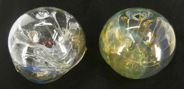 Glass: Peter Bramhall (b. 1942) American (two): UNTITLED, a pair of clear glass body with color free-form interiors, each signed, each 9” diameter, with blow-holes. (2)