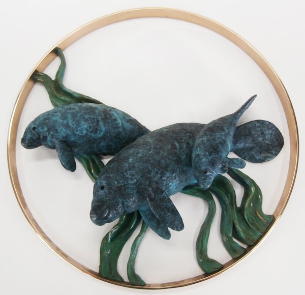 Robert Wyland (b. 1956) American: MANATEE FAMILY, 1992, cast bronze sculpture with green patina, signed, from the edition artist’s proof 50, diameter 23”, a few scuffs and scratches on outer ring, otherwise in good condition.