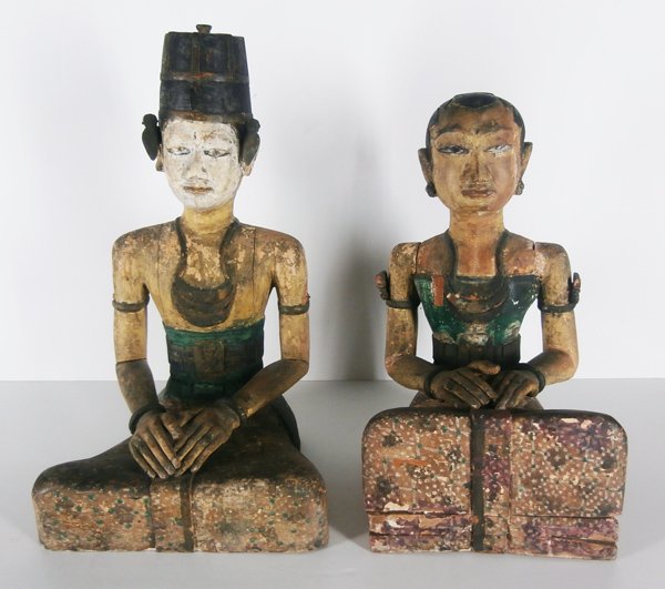 Southeast Asian carvings (two): LORO BLONYO (inseparable couple), Java/Indonesian painted wood statues, each 24” tall, cracks & minor losses, in good aged condition. (2)