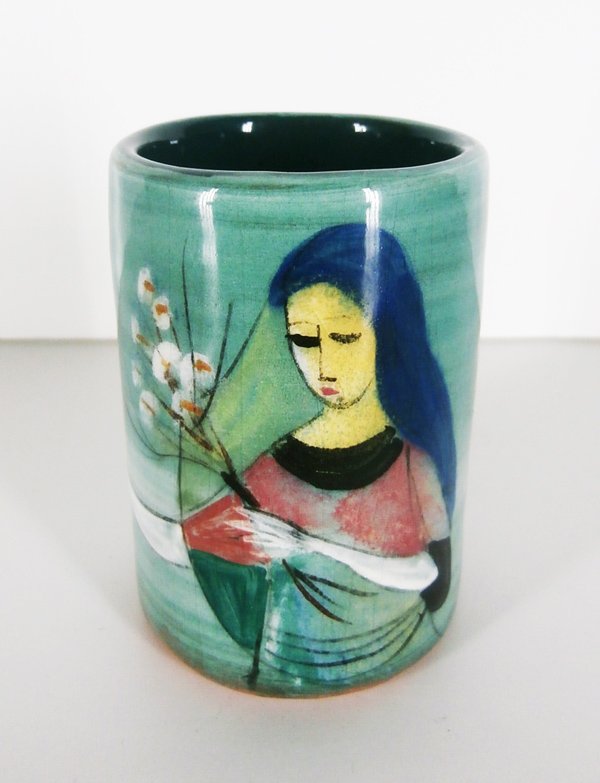 Polia Pillin (1909-1992) Californian: WOMAN WITH BLUE HAIR AND FLOWERS, hand painted and glazed ceramic cup, signed underneath, 3 ¼” tall, 2 ¼” diameter, tiny surface chip on inside rim, otherwise in good condition.