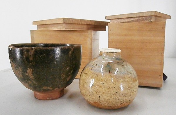 Old Japanese Ceramic (two): An early 18th century ceramic cup, partially glazed, 4” diameter, a few small losses, comes with custom wooden box; antique ceramic vessel with white cap, comes with silk pouch and custom wood box, 
