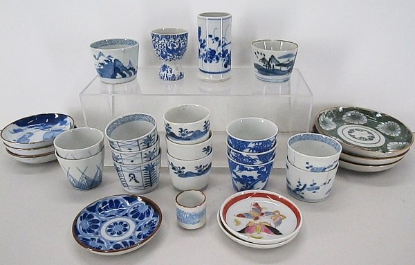 Various Ceramics (twenty-seven): A collection of fifteen blue & white Imari cups including three sets of three, two sets of two, plus two singles, average size 2 ¼”, some with rim chips; Together with a blue & white egg cup, 3” 