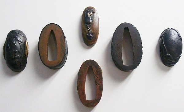 Fuchi Kashira (three sets): Three fuchi and kashiras sets, one signed Yasuchika’, mid Edo period, in apparently good aged condition. Provenance: Sotheby’s sale #5725, lot 740. (3)