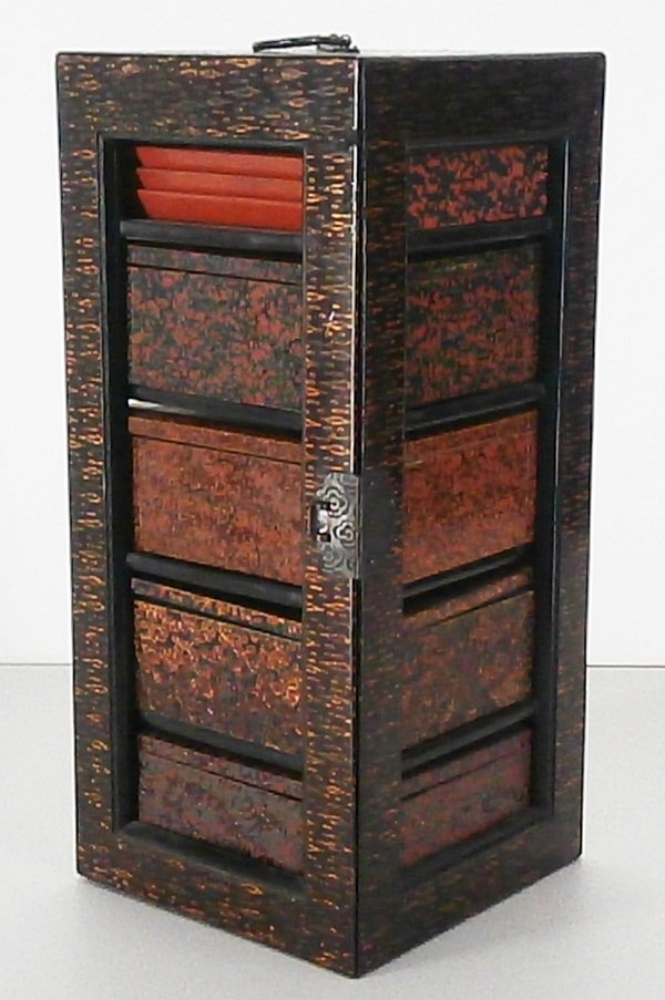 Lacquerware Sage-Jubako: 19th Century Wakasa (youth) style picnic basket set, opens to four square boxes and one triangular box and five trays, closed 13 x 6 x 6”, with metal handle and clasp, in good used condition.