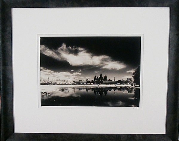 John McDermott (20th/ 21st Century) American: SOLAR ECLIPSE ANGKOR WAT ANGKOR SIEM REAP, CAMBODIA, 1995, gelatin silver print, signed in marker, from the numbered edition 40, image 15 ½ x 22 ½”, with certificate from artist, framed, in appare
