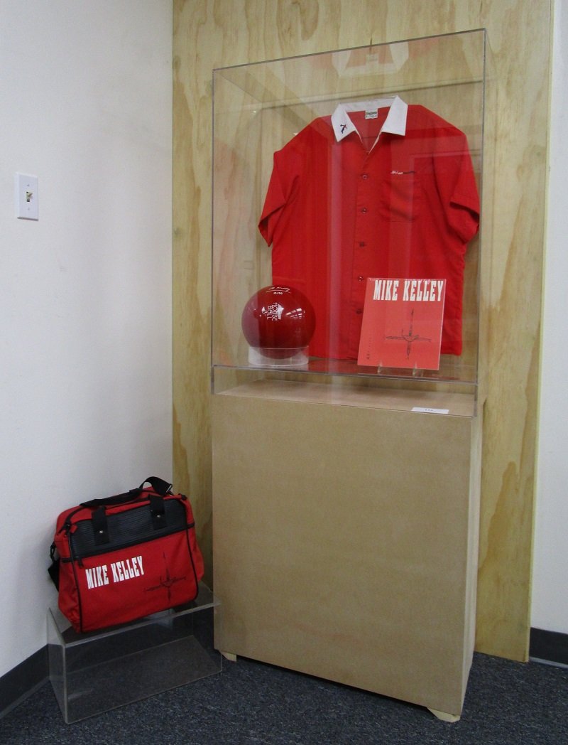 Mike Kelley (1954-2012) Californian: BOWLING BALL, BAG, SHIRT & CATALOGUE, 1991, complete set of four objects, signed and numbered with an electro-pen on the bowling ball, from the edition 50, published by A.R.T. Press, Los Angeles, with