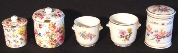 Hammersley English Bone China, Limoges, French por: A pair of Hammersley English Bone China containers with floral pattern, 2" & 2 ¾" tall, each with slotted lids, stamped and inscribed 3257A, natural surface cracking; Together with a pair of Limoges