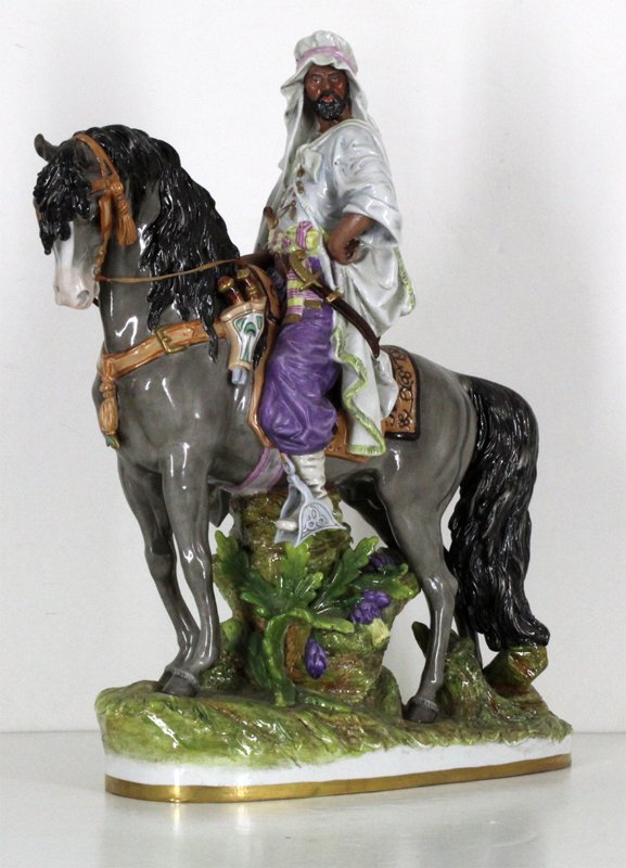 European Porcelain: Scheibe Alsbach: THE ARABIAN RIDER, large polychrome porcelain figure, blue hallmark lower base center rear, 21 x 17 x 7”, with miniscule nick at tip of ear, otherwise in good condition.
