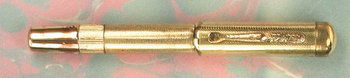 A MONTBLANC 1-SIZE 18CTR SAFETY: A MONTBLANC 1-SIZE 18CTR SAFETY Probably German, 1920s-30s marked 18ctr on the ornate clip, with barley design overlay, (removable) metal cap crown fitting over the white star, and 14 Carat 1