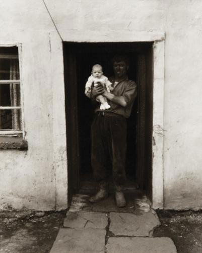 Bruce Davidson (b.1933) south wales (coal miner w: Bruce Davidson (b.1933) untitled (coal miner with infant, south wales), 1970Gelatin silver print, printed c.1970, signed in ink and Bruce Davidson / Magnum Photos credit stamp on verso. paper