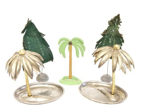 A selection of palm tree objects: A selection of palm tree objectsincluding a Euan Uglow, A Happy Christmas, felt Christmas tree cards as sent to Craigie, and two metal palm trees as featured in the Indian Crucifixion works (