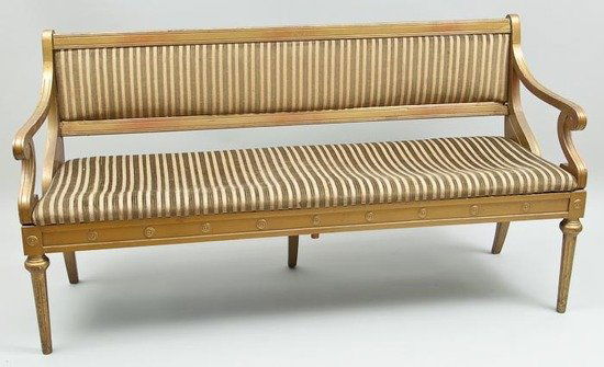 A pair of gilt painted settees: A pair of gilt painted setteesearly 20th century, with padded backs, scrolled arms and fluted turned legs, 168cm wide