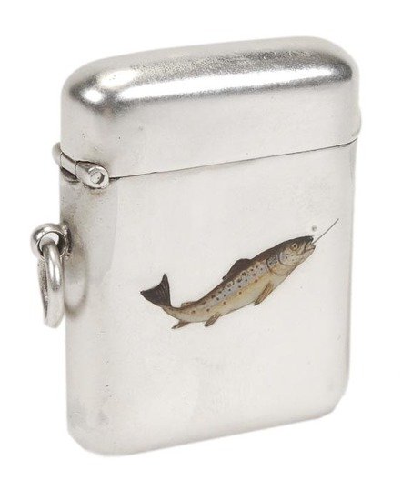An Edwardian silver and enamel oblong vesta case b: An Edwardian silver and enamel oblong vesta case by Sampson Mordan & Co., Chester 1904, enamelled in colours with a fish outlined, a line in its mouth, the rest plain, with a suspension ring,