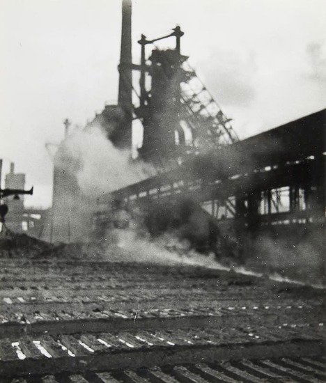 Eva Besnyö (1910-2002) Hoogovens, 1935: Eva Besnyö (1910-2002) Hoogovens, 1935Two gelatin silver prints, photographer's stamp and annotated in blue crayon verso, 17.9 x 17cm (7 x 6 3/4in); 21 x 18cm (8 1/4 x 7 1/8in)