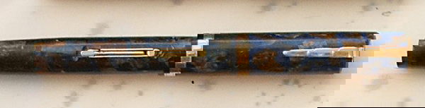 WATERMAN'S LADY PATRICIA, 1932-34: A WATERMAN'S LADY PATRICIACanadian, 1932-34 turquoise (blue and gold-bronze marble) celluloid with Waterman's Ideal 2 medium nib, very good noting slight polishing wear, a hard colour to find
