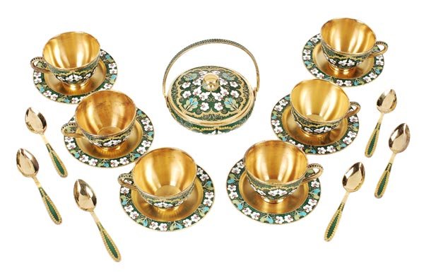 A Soviet Russian silver coloured gilt and enamel c: A Soviet Russian silver coloured gilt and enamel coffee service, post 1958 .916 standard, circa 1976, with floral decoration on a green ground, comprising six of coffee cups, saucers and spoo