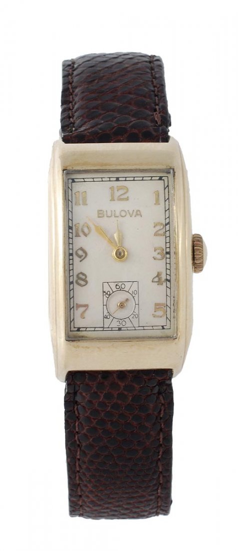 Bulova, a gold filled driver's watch, circa 1937,: Bulova, a gold filled driver's watch, circa 1937, no. 8616199, the two piece curved rectangular case with cream dial applied gilt Arabic numerals and Bulova Modern hands, and subsidiary secon