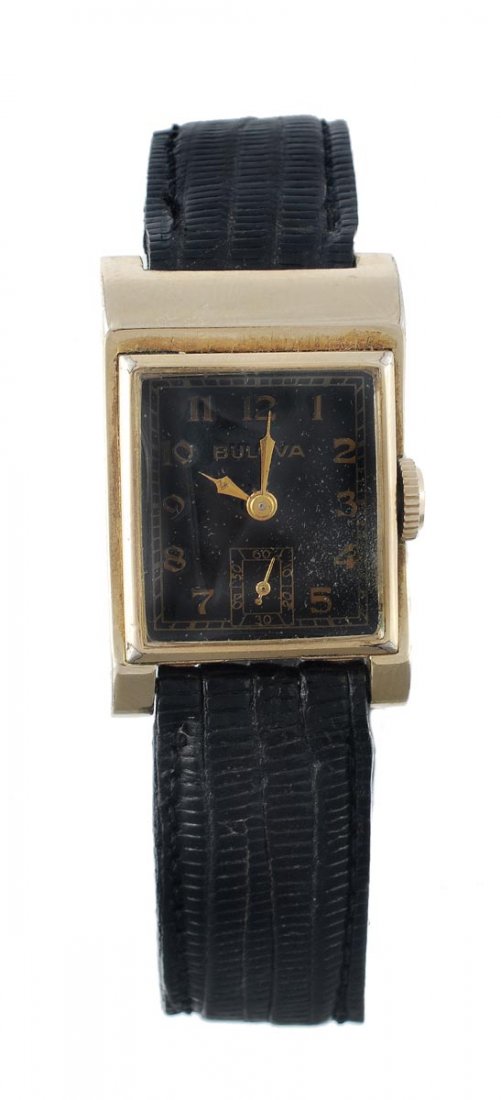 Bulova, a 1940s gold filled wristwatch, no. 944106: Bulova, a 1940s gold filled wristwatch, no. 9441067, the two piece asymetrical case with black enamel dial, applied gilt Arabic numerals and Bulova Modern hands, the 17 jewel Bulova movement