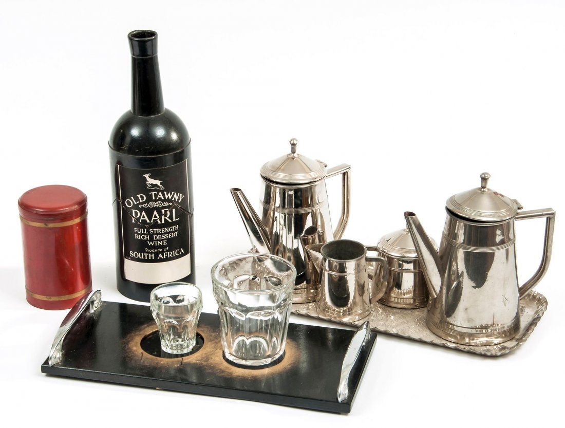 Disappearing Pigeon and Glass Bottle Trick,: the bottle only, 310mm. high, Hamleys ?; Wonderful Coffee Trick, chrome coffee pot, milk jug, sugar basin, and tray, with a second earlier coffee pot; Ink to Goldfish, the glass with chrome stand and 