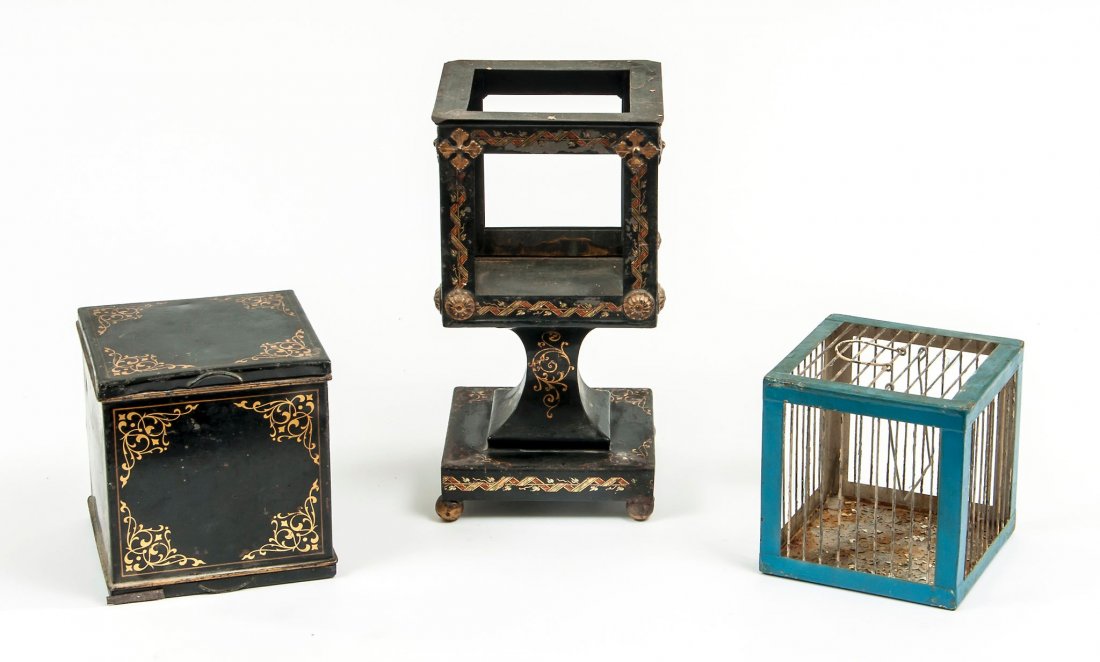 Flying Bird Cage,: comprising a collapsible cage inside a metal box with hinged top and base and a second collapsible cage in pedestal stand, the cages painted, the box and stand with tole decoration, 145 and 275mm. hig