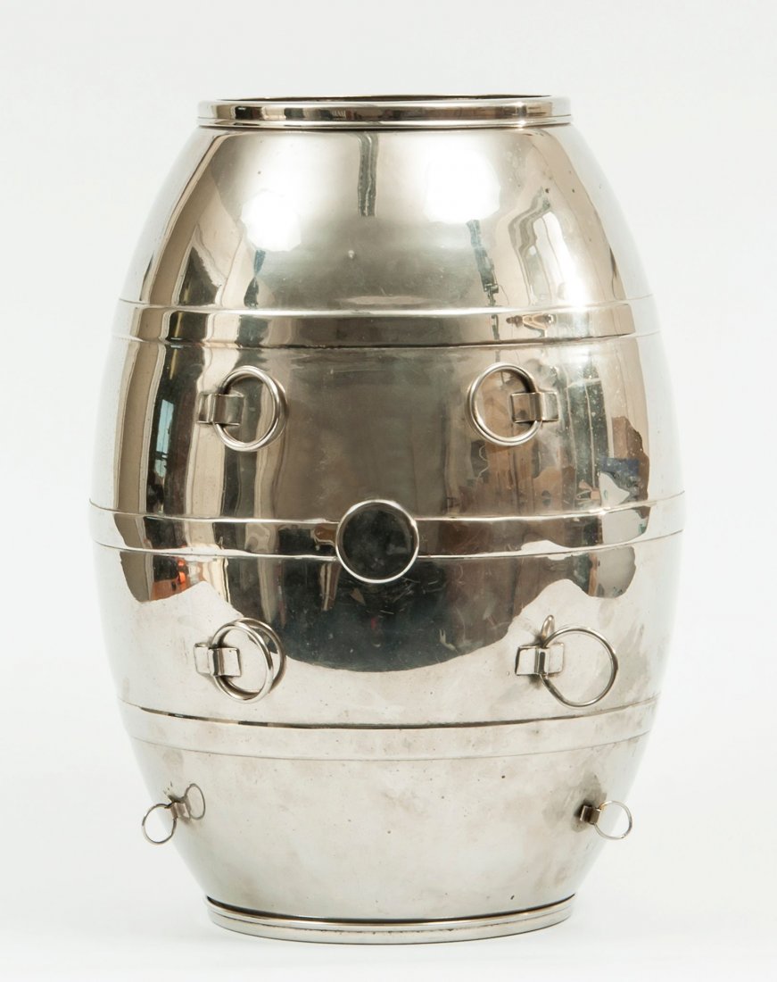 Mysterious Wine Barrel,: the chrome barrel with rings to suspend it and detachable rims, apparently lacking tap , with Davenport’s invoice dated 1976, 355mm. long, max. diameter 255mm .