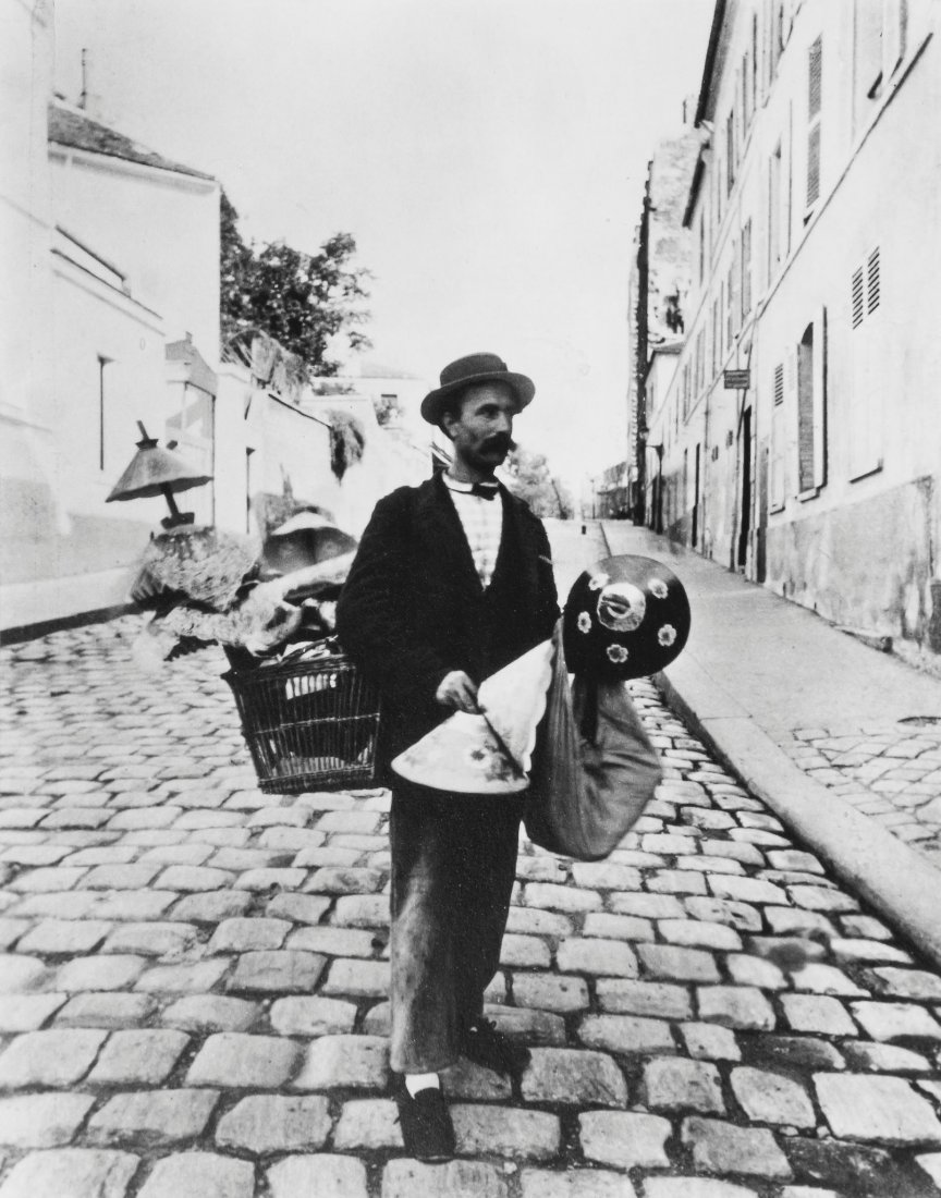 EugÃ¨ne Atget (1857-1927) - Marchand Abat-Jours,: Gelatin silver print, printed in 1956 and signed by Berenice Abbott, with 'EugÃ¨ne Atget Photograph, Printed by Berenice Abbott' stamp on mount verso, 20.4 x 16cm (8 1/7 x 6 1/4in)