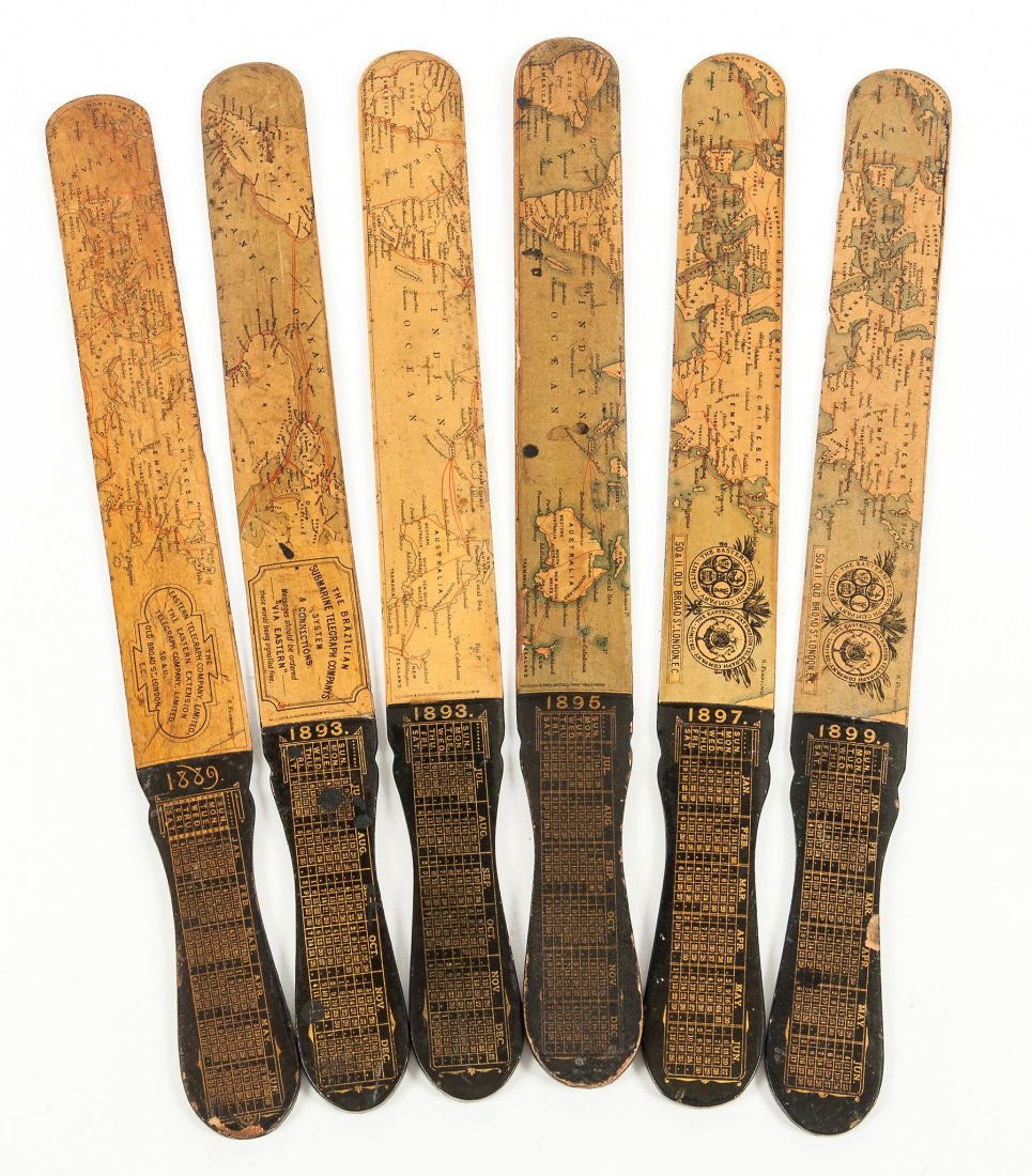 The Eastern Telegraph Company Ltd.- - A group of five: decorated with various lithographed maps of the world, each c.33 cm., dated between 1889 and 1899; with another letter opener for The Brazilian Submarine Telegraph Co., (6).