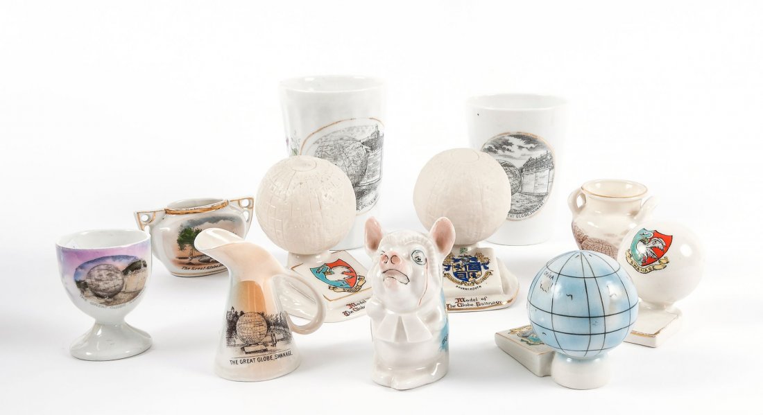 A selection of commemorative china, two relating to the: A selection of commemorative china, two relating to the Swanage Globe, including one crested china miniature globe, two various beakers, an egg cup, a jug, and a vase, and a model of a pig printed wit