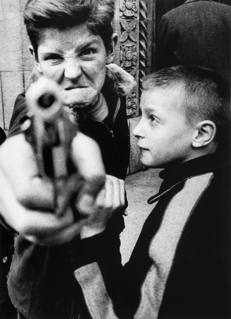 William Klein (b.1928) - Gun 1, New York, 1955: Gelatin silver print, printed later, signed, titled, dated and annotated in pencil verso, 36.5 x 26.5cm (14 3/8 x 10 3/8in)